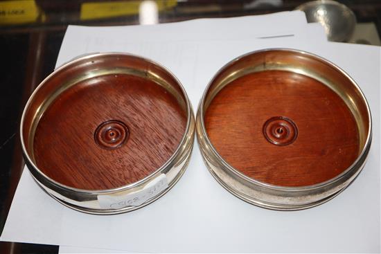 Two pairs of modern silver wine coasters, largest 13.2cm.